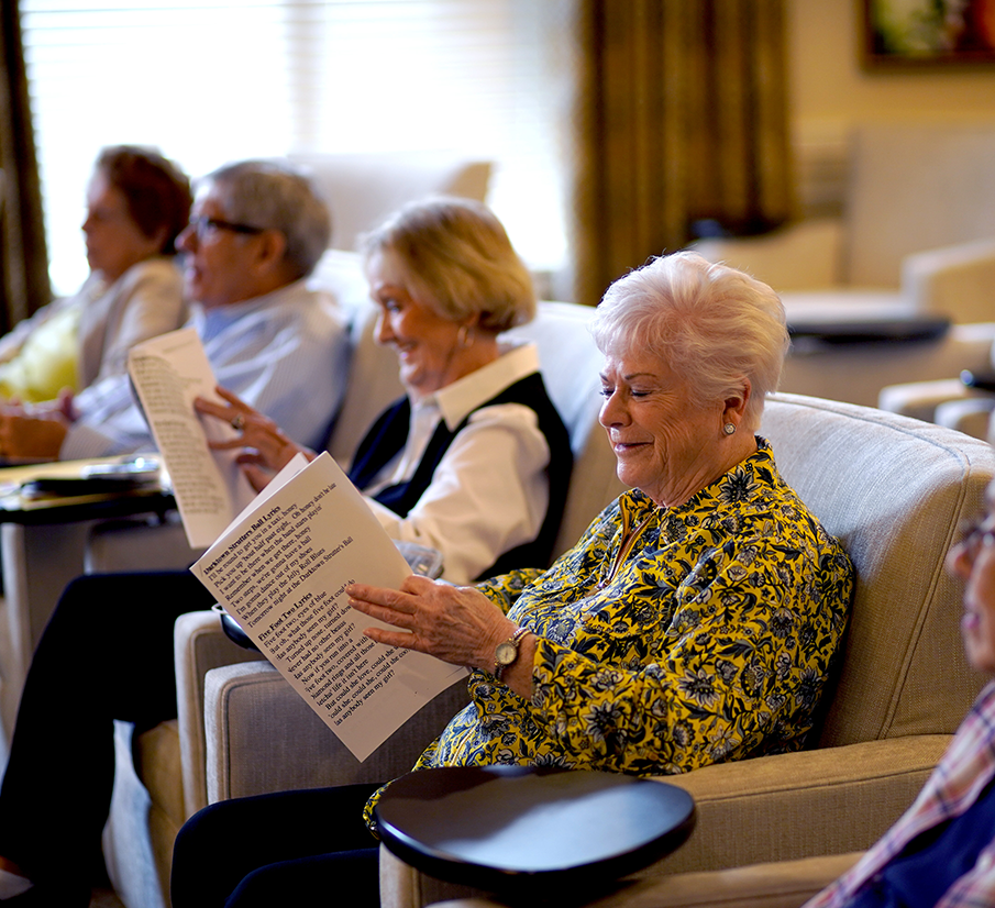 Lady smiling looking at papers