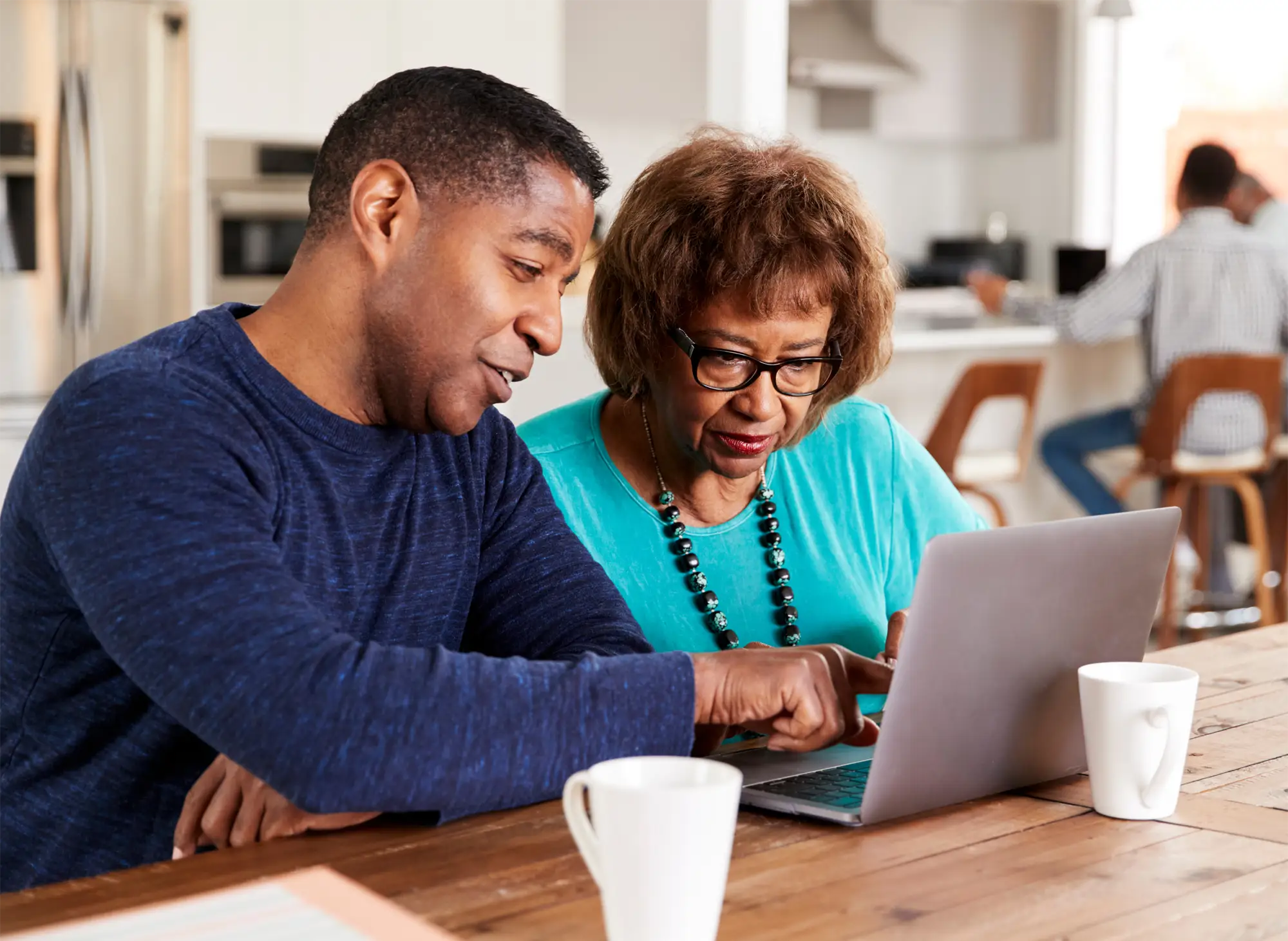 Mother and Son Looking at Senior Living Options