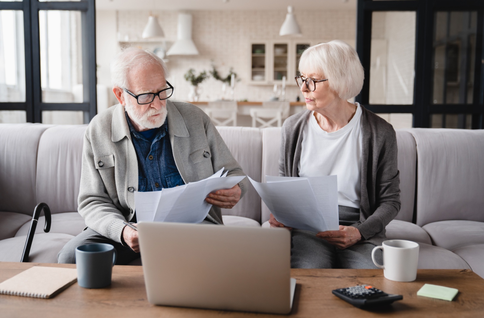 A senior couple smile as they decide to move into an independent living community