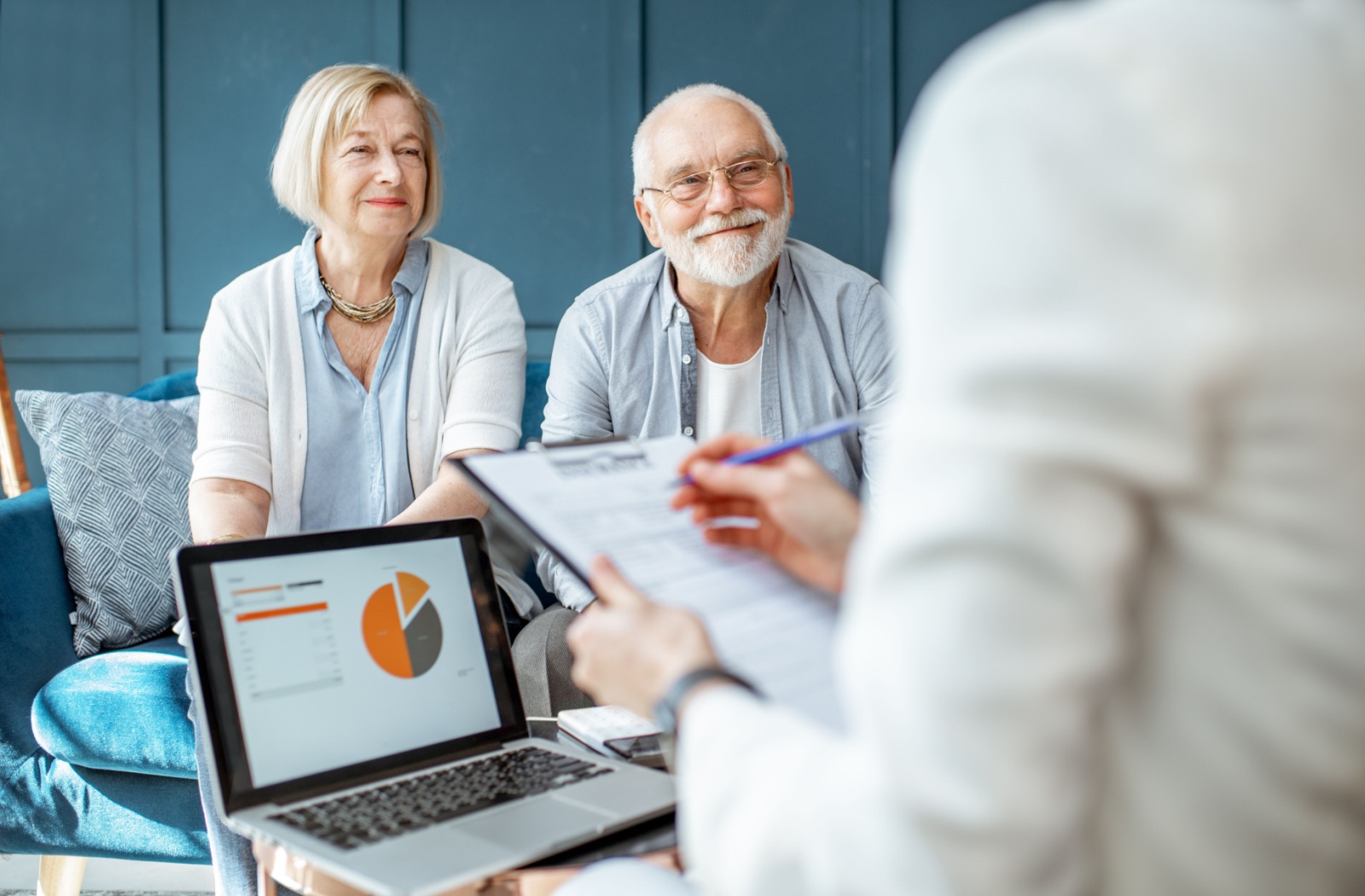 A senior couple explores the financials of senior living with a professional